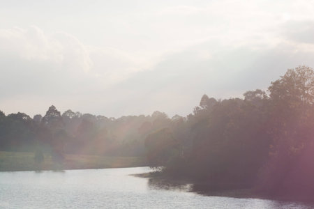 lakeside sunset at Khaoyai National Park Thailand with flare from the right sideの写真素材