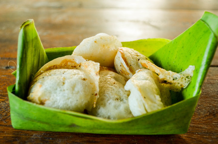 Thai dessert made from coconut milk,flour,sugar and little salt in basket of banana leaf.の写真素材