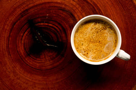 Cup of coffee on the woodの写真素材