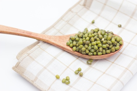green mung beans over the wooden spoonの写真素材
