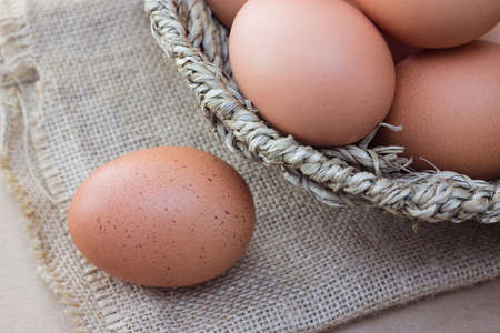 Basket with eggs on sackcloth