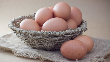 Basket with eggs on sackcloth