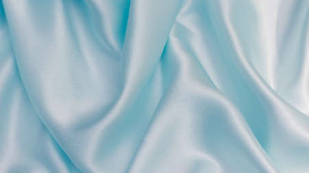 Smooth elegant blue silk can use as backgroundの写真素材