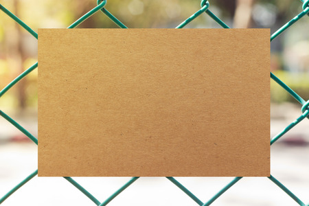 Brown paper on metal fenceの写真素材