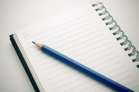  Notebook and pencil on white backgroundの写真素材
