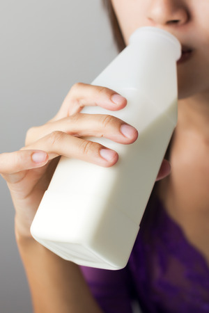 Woman drinking milkの写真素材