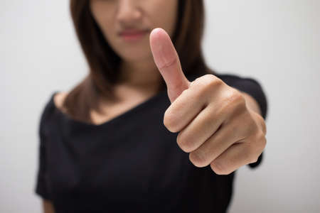 Happy woman with thumbs up