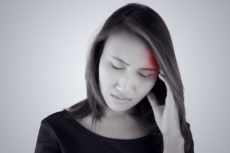 Headache. Asian woman having a headacheの写真素材