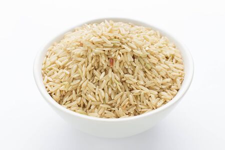 Whole grain organic brown rice in a bowlの写真素材