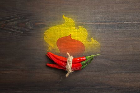 Red hot chili pepper on wood backgroundの写真素材