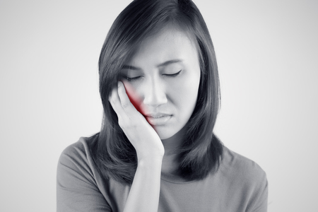 Have a toothache isolate on white backgroundの写真素材
