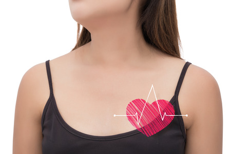 Beautiful woman is clutching her chest. Heart disease. Acute pain possible heart attack.