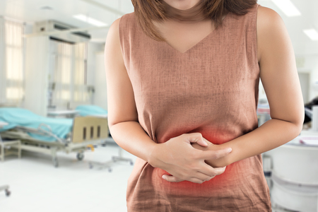 The woman has stomachache and go to hospital urgent . People with diarrhea problem conceptの写真素材