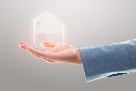 Businesswoman showing a house illustration, Property insurance, and security concept.の写真素材