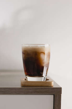 The glass of cola with ice