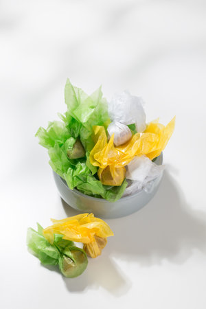 Caramel-flavored candies and peanuts wrapped in various colored paper are souvenirs from Chonburi province, Thailand.の写真素材