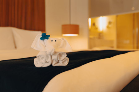 Phetchaburi  \ Thailand - January 24 2026: Elephant-shaped towel art placed on a bed represents warm hospitality and traditional Thai welcome for guests staying at a beachfront resort in Hua Hin.のeditorial素材