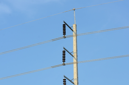 High-power tower Power transmission system.High voltage transmission line.high voltage pole Power transmission system With sky background image. High-voltage tower at blue sky background..の写真素材