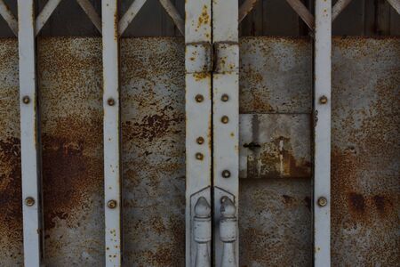 Old door fence Made of painted steel. Rusty and dirty