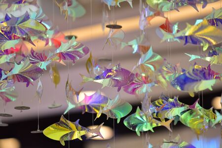 The fish is made of reflective paper and the beautiful bokeh is used as background image.の写真素材