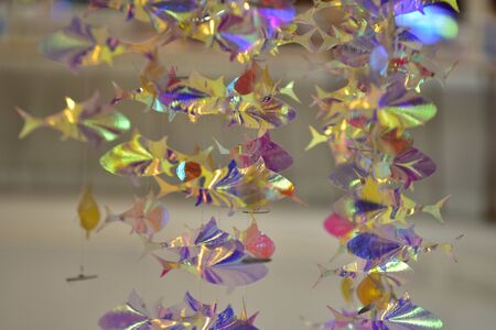 The fish is made of reflective paper and the beautiful bokeh is used as background image.の写真素材