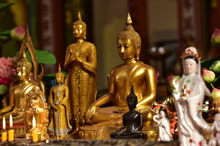 Beautiful Buddha image with candle light in Thai templeのeditorial素材