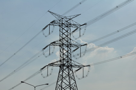 Power transmission system With the sky and the beautiful clouds in bright days. Power poles and power lines. Optical fiber system Internet communication system at the power polesの写真素材