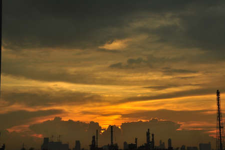 Sunset and golden yellow sky Around the International Airport. Beautiful clouds when there is a beam from the sun.の写真素材