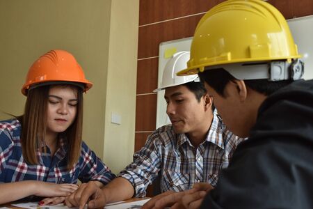 architect with business man and engineer are planning on document.