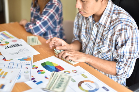 cash business Dividing Benefits . Cash Business Sharing money To use in the job The result is quite a lot of money.の写真素材