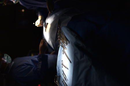 Team surgeon at work in operating room. Surgical light in the operating room. Preparation for the...