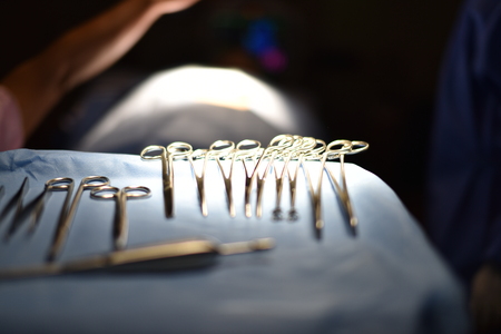 Surgical light in the operating room. Preparation for the beginning of surgical operation with a cut. Team surgeon at work in operating room.の写真素材