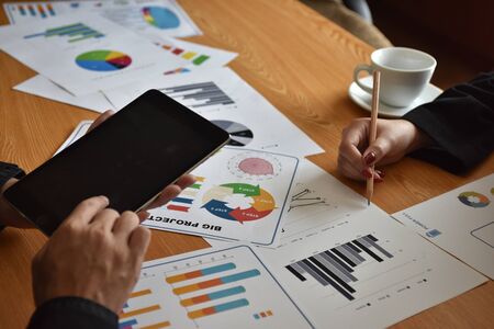 Business man hand pointing to graph information. new startup project. Idea presentation, analyze plans. Business Communication Connection Working Concept. Business People Meeting.business report.の写真素材