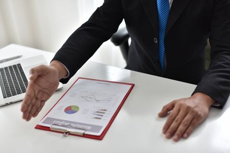 Business man hand pointing to graph information. new startup project. Idea presentation, analyze plans. Business Communication Connection Working Concept. Business People Meeting.business report.の写真素材
