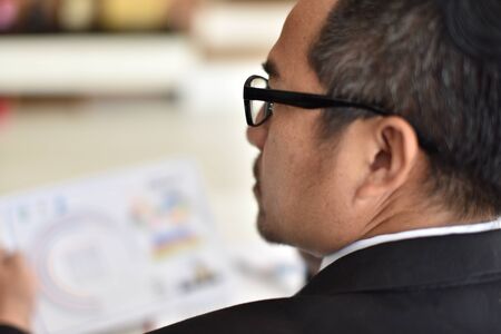 Businessman are stressed out badly by bad business.の写真素材