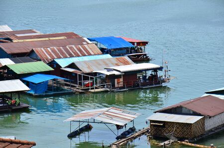 The wooden bridge in Kanchanaburi, Thailand, on a bright day. 13/08/2017: Tourists on morning day at wooden mon bridge in Sangkhlaburi, Thailand.のeditorial素材