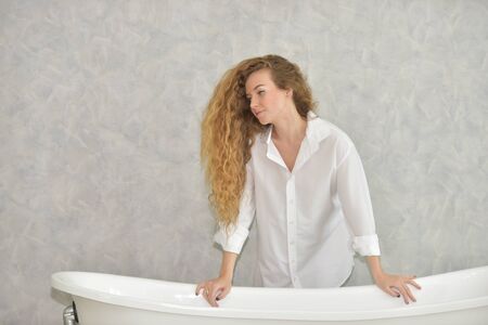 Beautiful woman with a sweet smile. In a lovely posture on a relaxing day.