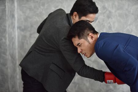 Business competition is like fighting in a boxing ringの写真素材