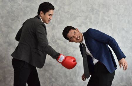 Business competition is like beating your opponent violentlyの写真素材