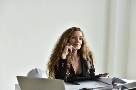 Portrait of smart young successful businesswoman in suitの写真素材