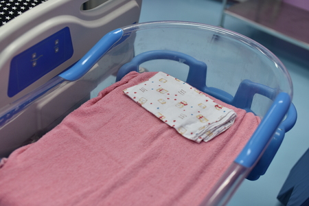 Empty baby bed in a hospital.