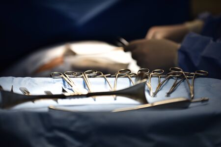 Team surgeon at work in operating room. Surgical light in the operating room. Preparation for the...