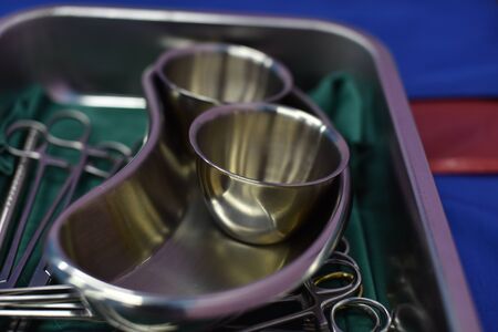 Team surgeon at work in operating room. Surgical light in the operating room. Preparation for the beginning of surgical operation with a cut. The surgeon is performing surgery on the patient.の写真素材