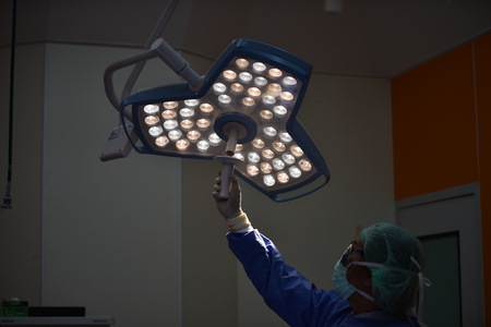 Team surgeon at work in operating room.Surgical light in the operating roomの写真素材