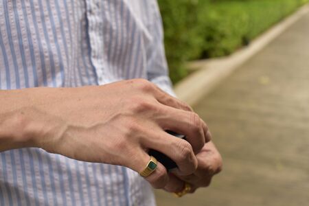 Hands Holding Golden and Silver Bitcoin Virtual Money Cryptocurrency. Bitcoin in the hands of a boy holds a metal coin of crypto currency in his handsの写真素材