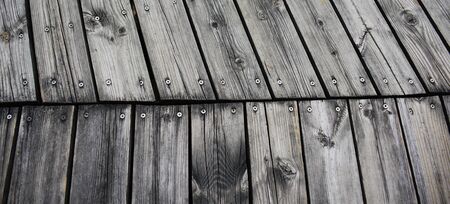 soft wood surface as background.Abstract wood wall and floor background.rustic weathered barn wood background with knots and nail holes.の写真素材