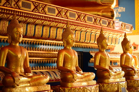 The golden Buddha image. Reverence in Buddhist sutras At Wat Luang Pothit, Thailandの写真素材
