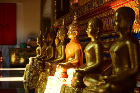The golden Buddha image. Reverence in Buddhist sutras At Wat Luang Pothit, Thailandのeditorial素材