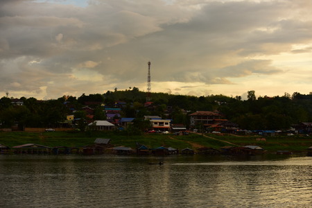 Sunset at the mountain in the early evening. The sky is golden, beautiful and colorful.の写真素材