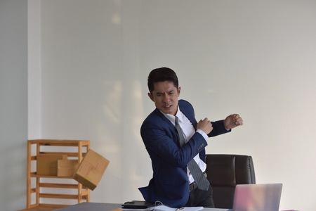 Entrepreneur sme stressed and furiously breaking on the desk. When the problem is heavy.の写真素材